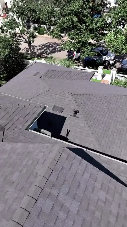 Architectural shingle — Drone pass over a finished charcoal shingle roof.